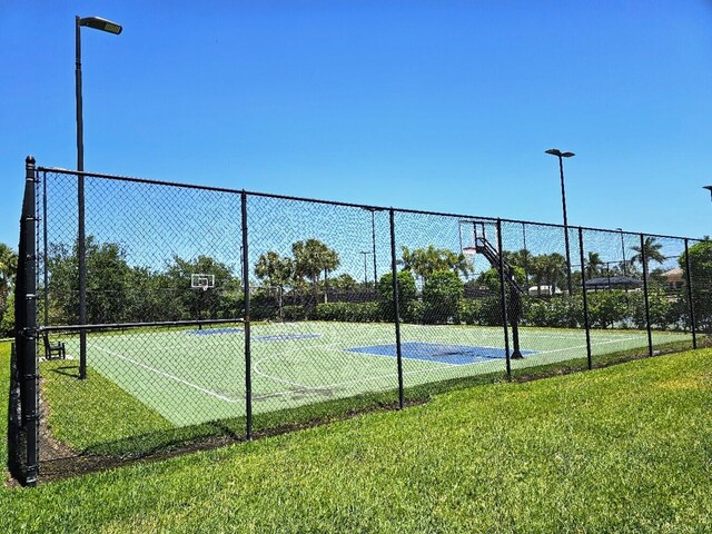 10902 SW Blue Mesa Way, Port Saint Lucie, FL 34987 - view of tennis court featuring community basketball court