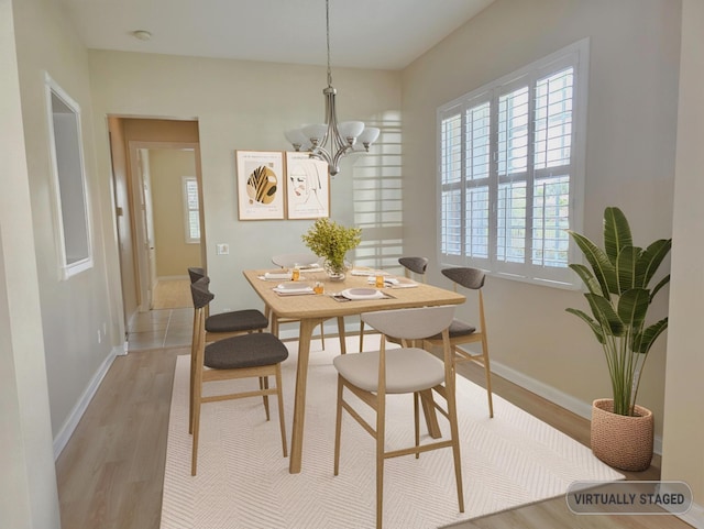 10902 SW Blue Mesa Way, Port Saint Lucie, FL 34987 - dining space featuring a chandelier and light wood-style floors