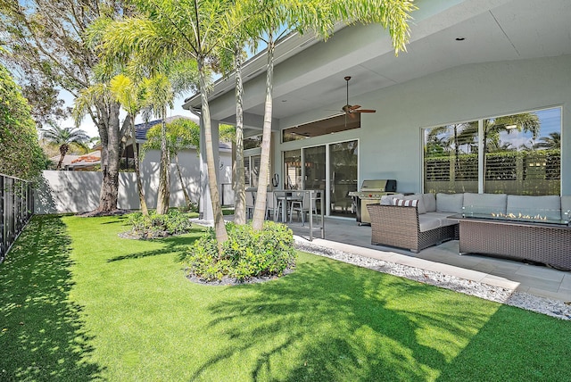 10740 Grande Blvd, West Palm Beach, FL 33412 - view of yard featuring a fenced backyard, an outdoor living space, a patio area, and a ceiling fan