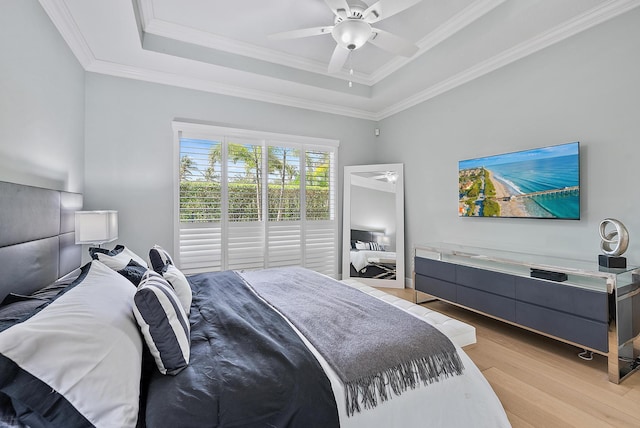 10740 Grande Blvd, West Palm Beach, FL 33412 - bedroom featuring light wood finished floors, a ceiling fan, crown molding, and a raised ceiling