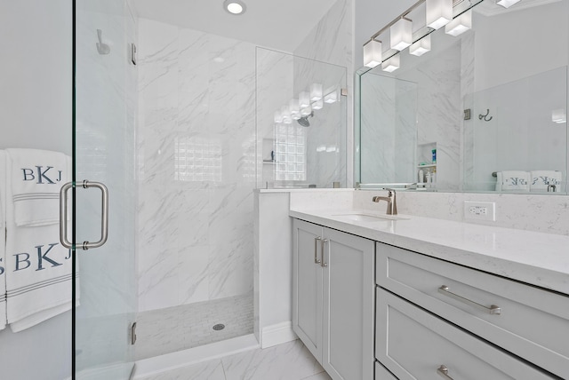 10740 Grande Blvd, West Palm Beach, FL 33412 - bathroom featuring marble finish floor, vanity, and a marble finish shower