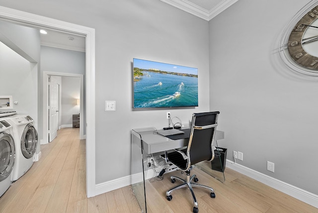 10740 Grande Blvd, West Palm Beach, FL 33412 - home office with washing machine and clothes dryer, ornamental molding, baseboards, and light wood-type flooring