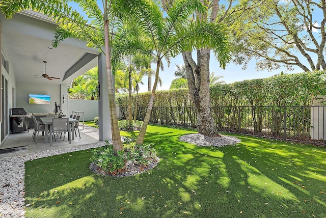 10740 Grande Blvd, West Palm Beach, FL 33412 - view of yard featuring a fenced backyard, a patio area, and a ceiling fan