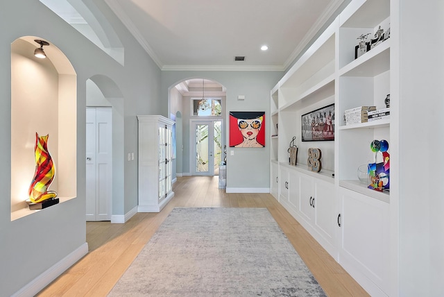 10740 Grande Blvd, West Palm Beach, FL 33412 - mudroom with visible vents, arched walkways, built in features, and light wood-style floors