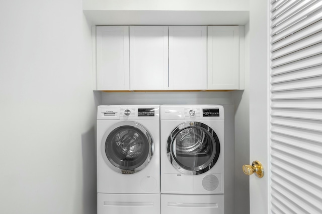 2773 S Ocean Blvd Unit 407, Palm Beach, FL 33480 - laundry room with cabinet space and washer and clothes dryer
