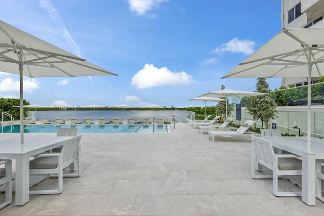 2773 S Ocean Blvd Unit 407, Palm Beach, FL 33480 - community pool with a patio and outdoor dining space