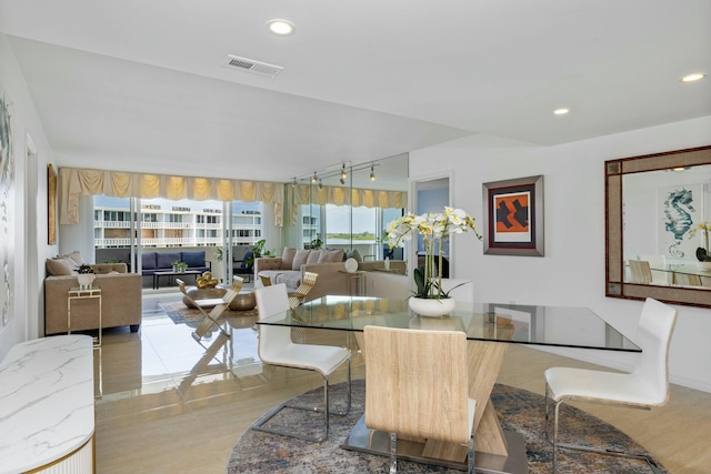 2773 S Ocean Blvd Unit 407, Palm Beach, FL 33480 - dining space featuring recessed lighting, wood finished floors, and track lighting