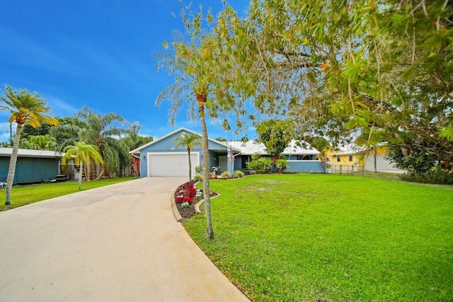 870 SW Gardens Blvd, Palm City, FL 34990 - ranch-style house with an attached garage, fence, a front yard, and concrete driveway