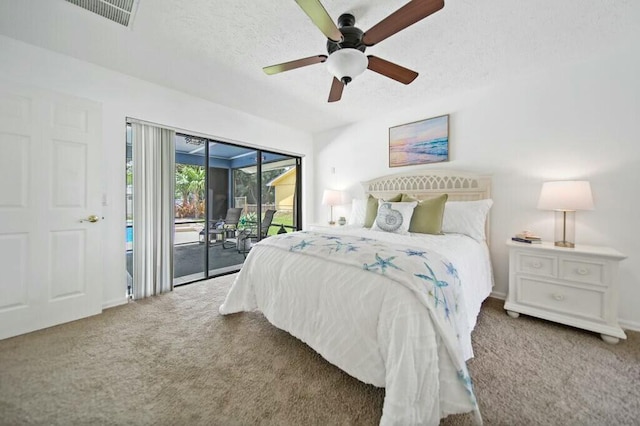 870 SW Gardens Blvd, Palm City, FL 34990 - bedroom featuring carpet flooring, access to exterior, visible vents, and a textured ceiling
