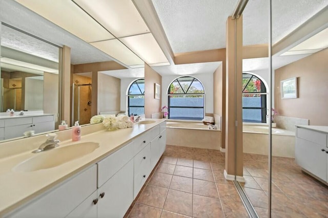 870 SW Gardens Blvd, Palm City, FL 34990 - full bathroom with a bath, a sink, double vanity, and a stall shower