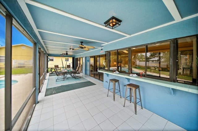 870 SW Gardens Blvd, Palm City, FL 34990 - sunroom featuring a ceiling fan and outdoor dry bar