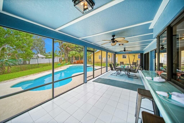 870 SW Gardens Blvd, Palm City, FL 34990 - sunroom / solarium featuring a ceiling fan and outdoor dining space