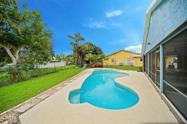 870 SW Gardens Blvd, Palm City, FL 34990 - view of swimming pool with a fenced in pool, a lawn, a patio, and a fenced backyard