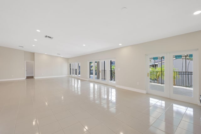 unfurnished room featuring visible vents, recessed lighting, baseboards, and light tile patterned floors