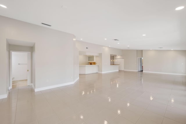 unfurnished room with visible vents, recessed lighting, baseboards, and light tile patterned floors