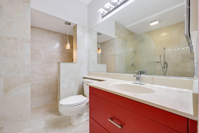 bathroom with vanity, toilet, tile walls, a walk in shower, and tile patterned floors