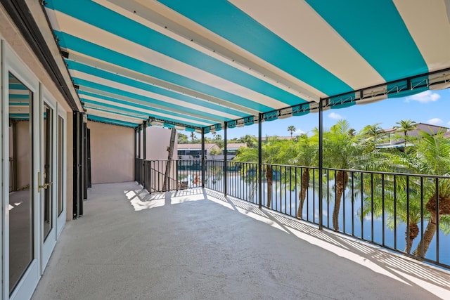 exterior space with a water view and a balcony