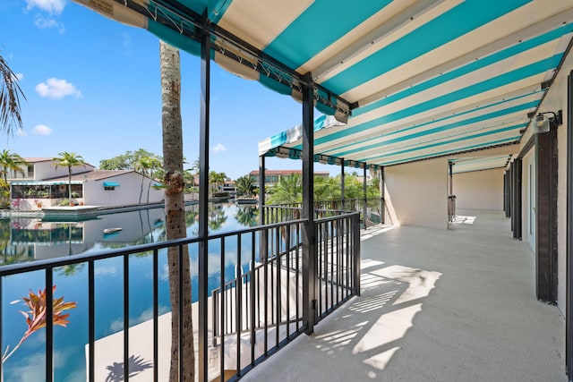 balcony featuring a water view