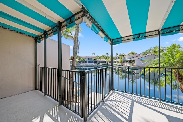balcony featuring a water view