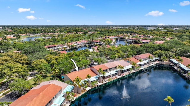drone / aerial view with a water view and a residential view