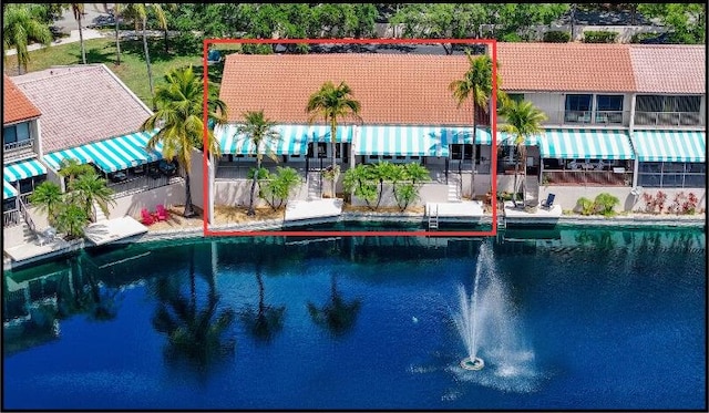 outdoor pool featuring a water view