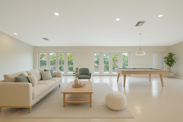 living room featuring visible vents, billiards, and french doors