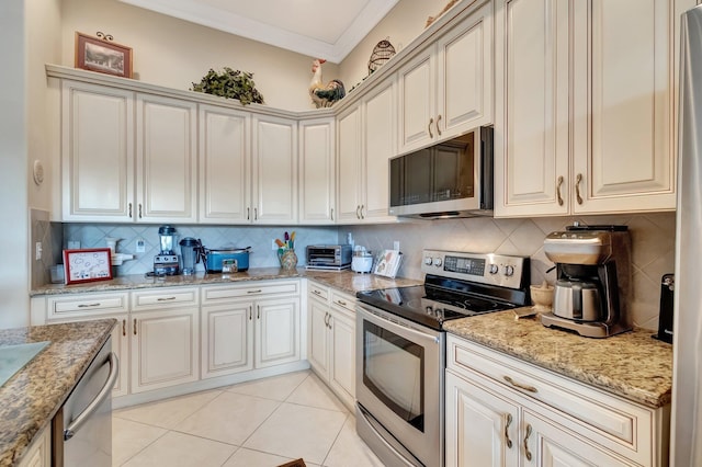 kitchen with crown molding, tasteful backsplash, appliances with stainless steel finishes, and light tile patterned floors