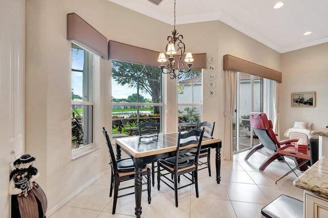 dining area with light tile patterned floors, plenty of natural light, an inviting chandelier, and ornamental molding