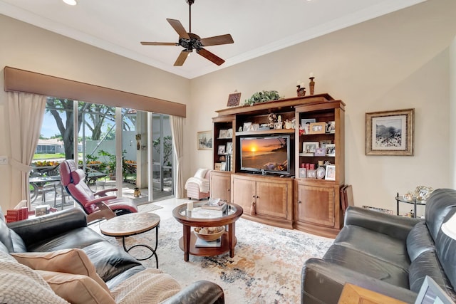 living area featuring ceiling fan, crown molding, and wood finished floors