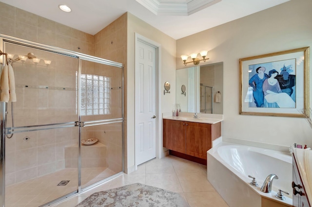 bathroom with crown molding, tile patterned floors, a stall shower, a bath, and vanity