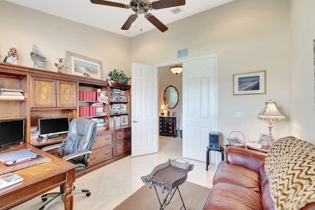 home office featuring visible vents, a ceiling fan, and light tile patterned floors
