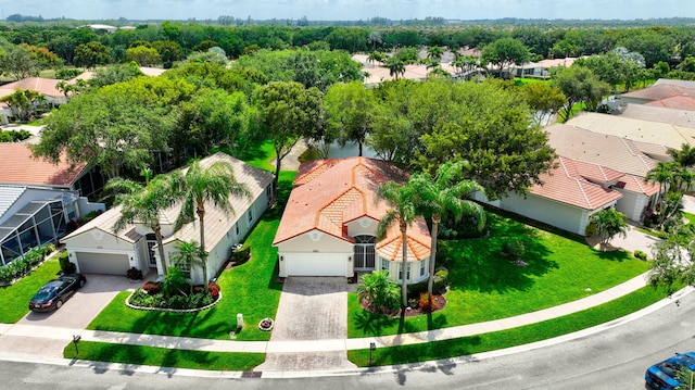 birds eye view of property with a residential view