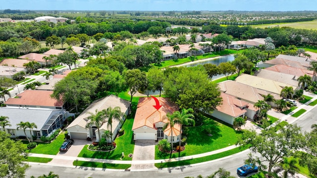 aerial view featuring a residential view and a water view