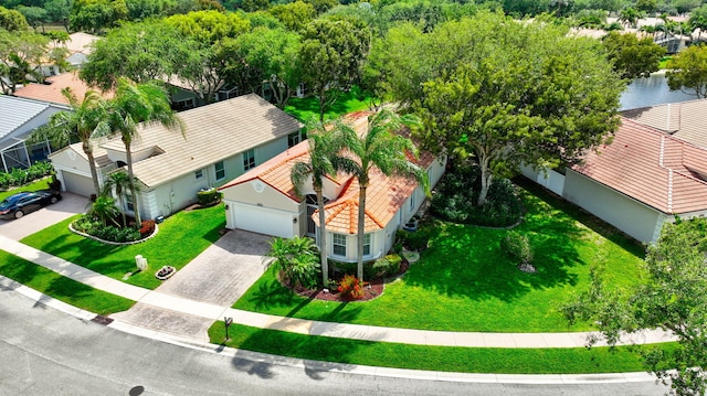 birds eye view of property with a residential view