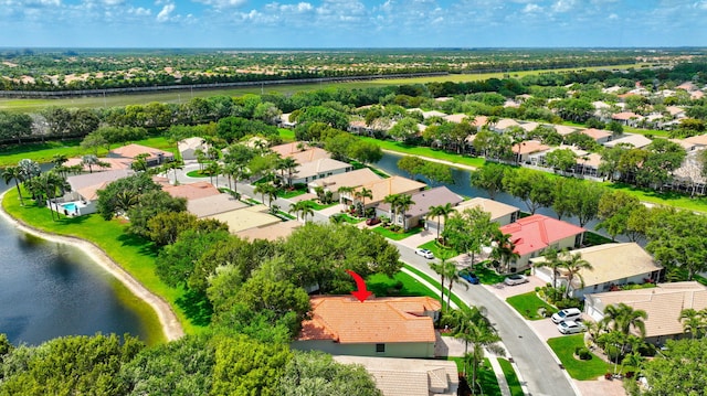 birds eye view of property featuring a residential view and a water view