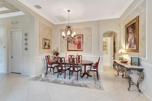 dining area featuring arched walkways, light tile patterned flooring, visible vents, a notable chandelier, and crown molding