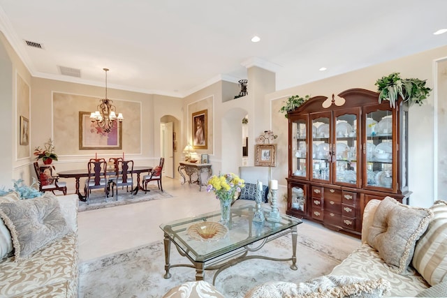 living area with an inviting chandelier, visible vents, arched walkways, and crown molding