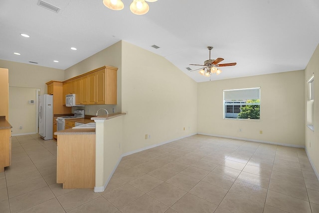 kitchen with visible vents, ceiling fan, a sink, and white appliances