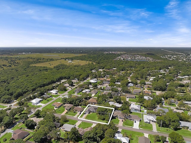 birds eye view of property with a residential view