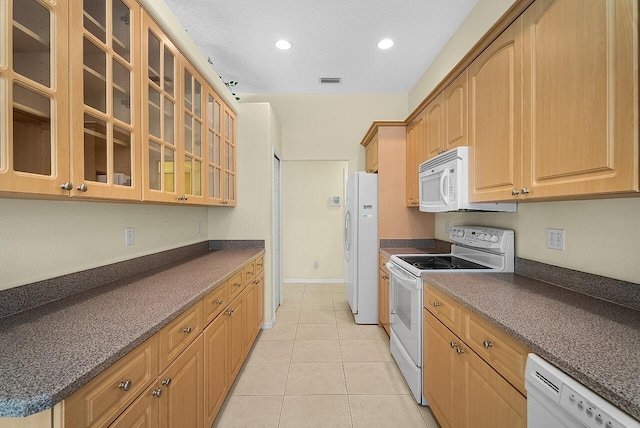 kitchen with recessed lighting, white appliances, light tile patterned floors, visible vents, and glass insert cabinets