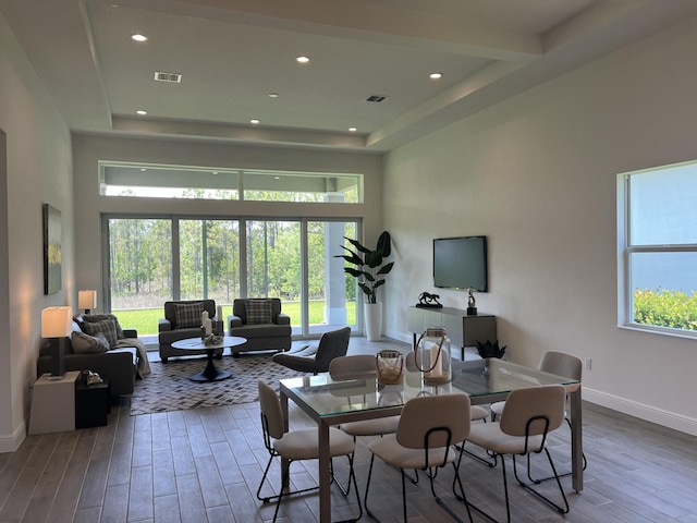 130 SE Palma St, Port Saint Lucie, FL 34984 - dining area featuring wood finished floors, baseboards, a high ceiling, and recessed lighting