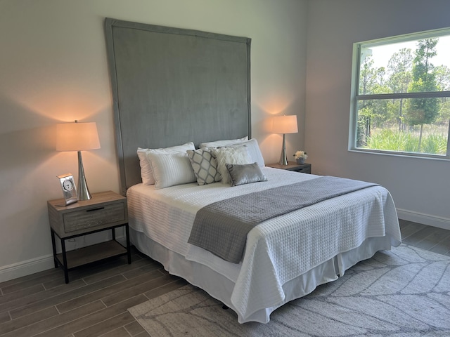 130 SE Palma St, Port Saint Lucie, FL 34984 - bedroom with wood finish floors and baseboards