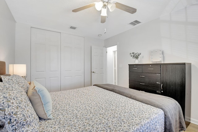 bedroom with a ceiling fan, a closet, and visible vents