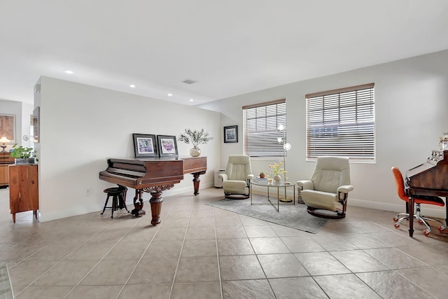sitting room featuring light tile patterned floors, baseboards, and recessed lighting