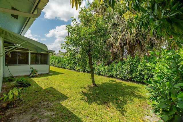view of yard featuring a sunroom