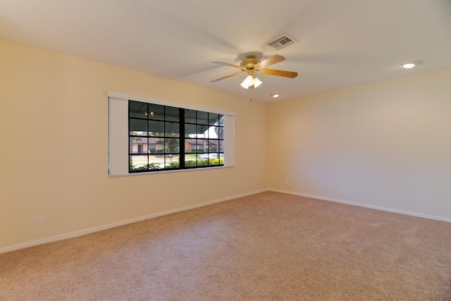 unfurnished room featuring ceiling fan, baseboards, carpet flooring, and visible vents