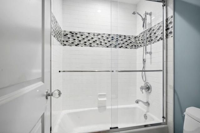9900 S Ocean Dr Unit 1601, Jensen Beach, FL 34957 - bathroom featuring combined bath / shower with glass door and toilet
