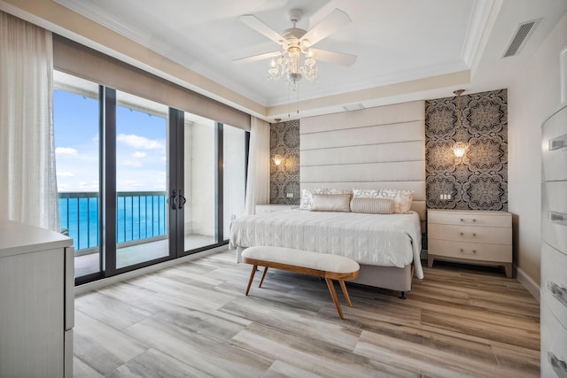 9900 S Ocean Dr Unit 1601, Jensen Beach, FL 34957 - bedroom featuring light wood-type flooring, visible vents, ornamental molding, and access to exterior