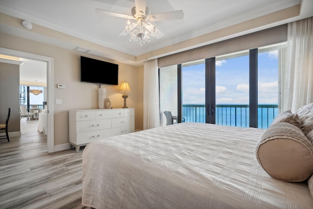 9900 S Ocean Dr Unit 1601, Jensen Beach, FL 34957 - bedroom featuring access to exterior, ornamental molding, light wood-type flooring, baseboards, and ceiling fan
