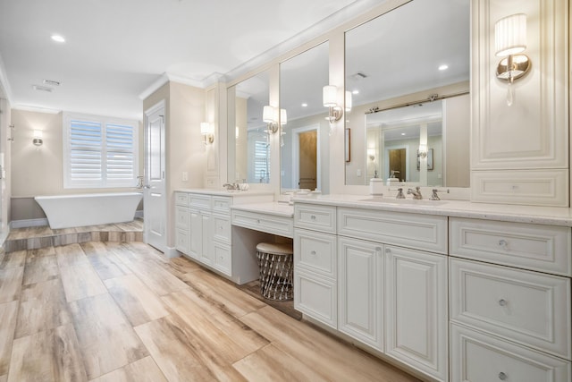 9900 S Ocean Dr Unit 1601, Jensen Beach, FL 34957 - bathroom with a freestanding bath, crown molding, and vanity